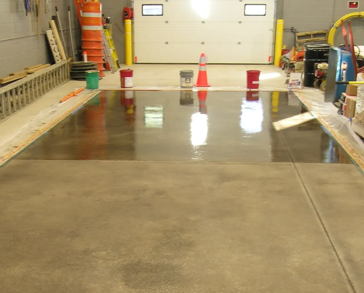 Clear-coated concrete floor showing raw concrete underneath
